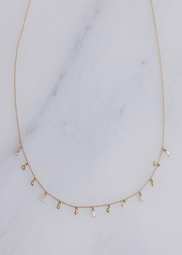 14K Gold Baguette and Round Drops Necklace .25ct